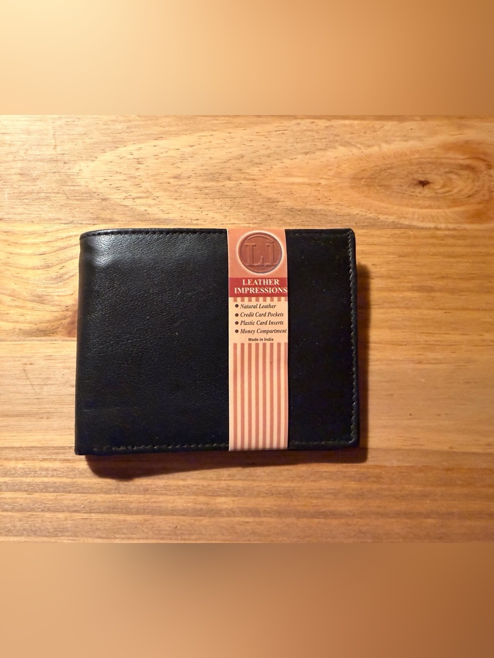 Impressions Black Leather Bi-Fold Wallet with Tan Label Accent